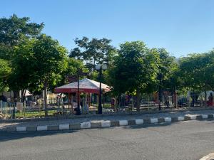 a park with a playground with a tent and trees at FREGATA 2 Studio Sveti Vlas in Sveti Vlas
