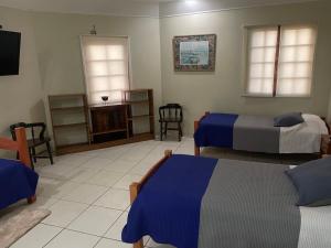 Кровать или кровати в номере Hotel Palermo Quintero