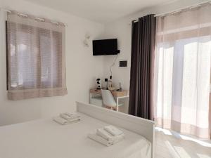 Postel nebo postele na pokoji v ubytování Zenia Rooms