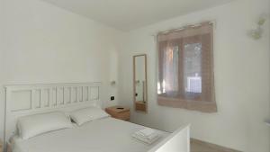 Postel nebo postele na pokoji v ubytování Zenia Rooms