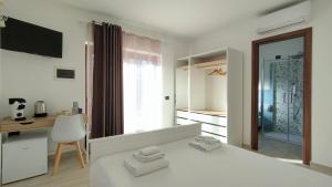 Postel nebo postele na pokoji v ubytování Zenia Rooms