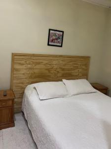 Кровать или кровати в номере Hotel Palermo Quintero