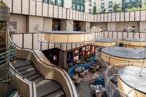 an overhead view of a building with stairs and tables at Radisson Collection Grand Place Brussels in Brussels