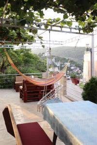 a hammock on the roof of a building at Apartments Baja in Ulcinj