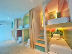 a room with bunk beds with a staircase in it at Hotel Nomadic Design in San Andrés +117 photos