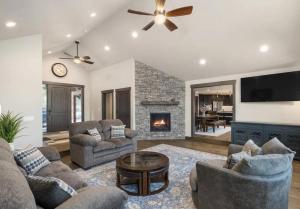 a living room with two couches and a fireplace at Summit House in Cle Elum