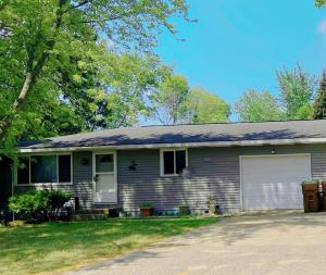 a gray house with a garage at Express Gateway in Stevens Point in Stevens Point