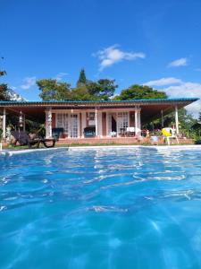 a house with a pool in front of it at Villa Monica in Montenegro