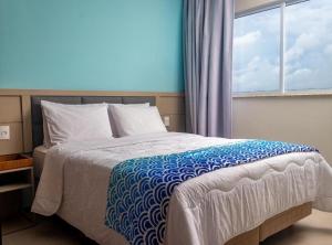 Aqualand Resort Apto 2 quartos Frente Mar ate 6 pessoas tesisinde bir odada yatak veya yataklar