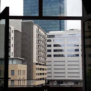 a view of some buildings from a window at 36 HydePark Apartments in Cape Town