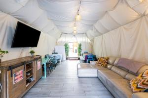 a living room with a couch in a tent at Samesun Ocean Beach in San Diego