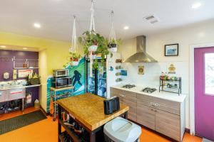 a kitchen with a sink and a counter top at Samesun Ocean Beach Hotel & Hostel in San Diego
