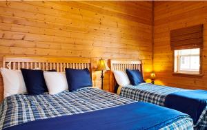A bed or beds in a room at Klondike Kate's Cabins