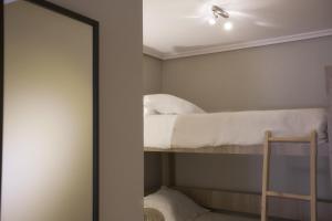 Postel nebo postele na pokoji v ubytování Hotel Los Lagos Nature