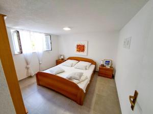 Ein Bett oder Betten in einem Zimmer der Unterkunft Apartments Ivanka