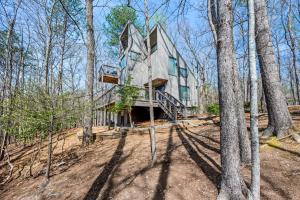 a house in the woods with trees at Baileys Mountain Retreat in Gatlinburg