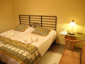 Cama o camas de una habitación en Casa Rural El Aguila