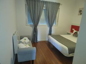 Ein Bett oder Betten in einem Zimmer der Unterkunft Apartamentos en Leis Muxia