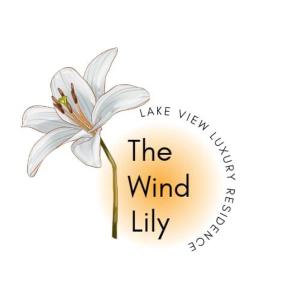 a white lily with the words lake waterfall the wind lily at THE WIND LILY - Lake View Luxury Apartment in Nuwara Eliya
