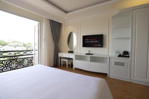 Postel nebo postele na pokoji v ubytování Le Marais Hotel Dalat + 37 fotografií