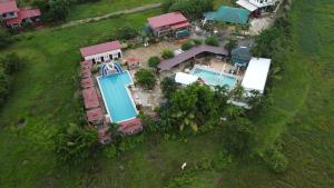 an aerial view of a house with a swimming pool at Pilot Hotel powered by Cocotel in Alaminos