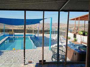 a swimming pool with a view of the mountains at shalyh tal birin in Şarrūt