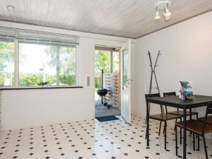 a dining room with a table and a window at 4 person holiday home in Sydals in Østerby +42 photos
