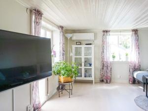 a living room with a large flat screen tv at 6 person holiday home in LYSEKIL-By Traum in Lysekil