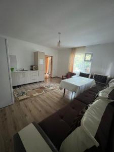 a living room with two beds and a couch at Meerim Murok in Bosteri
