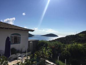 a house with a view of the ocean at Pousada Recanto Marinho in Arraial do Cabo