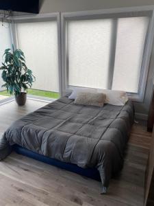 Cama ou camas em um quarto em Condo de luxe vue sur golf, spa, foyer extérieur