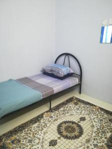 Katil atau katil-katil dalam bilik di Homestay siti