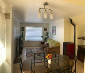 Posezení v ubytování Casa de la Ribera Collipulli + 2 fotografie