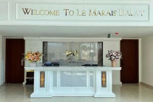 a welcome to lb marias datta sign in a building at Le Marais Hotel Dalat in Da Lat