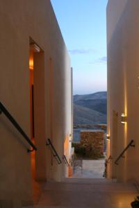 a hallway of a building with a view of a mountain at Yehelim Boutique Hotel in Arad