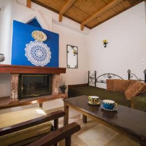 a living room with a couch and a table at Αρχοντικό Κονάκι- Konaki Pelion in Tsagarada