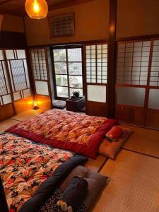 Ένα ή περισσότερα κρεβάτια σε δωμάτιο στο Old Japanese House