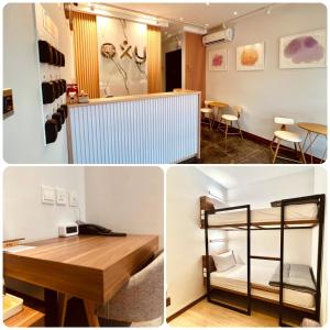 Zimmer mit einem Schreibtisch und einem Zimmer mit einem Etagenbett in der Unterkunft oxy suites G-03 at Shop House Meisterstadt Pollux Habibie in Batam Center
