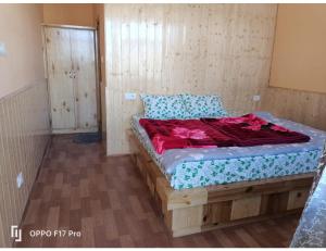 a bedroom with a bed in a room at Hotel Himalayan Hermitage, Kaza in Kaza