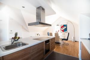 a kitchen with a sink and a counter top at Milic Apartments - by the sea in Sutivan