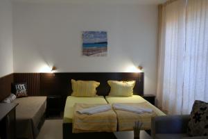 Postel nebo postele na pokoji v ubytování Hotel Paradise