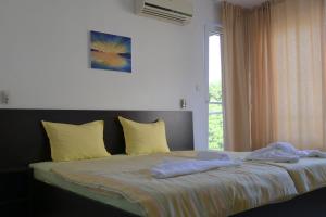 Postel nebo postele na pokoji v ubytování Hotel Paradise