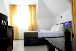 Postel nebo postele na pokoji v ubytování Hotel Paradise