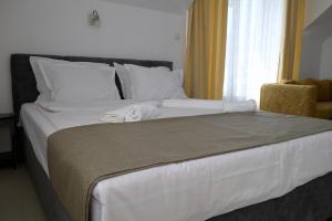 Postel nebo postele na pokoji v ubytování Hotel Paradise