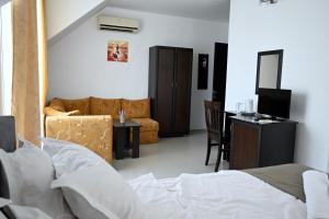 Postel nebo postele na pokoji v ubytování Hotel Paradise