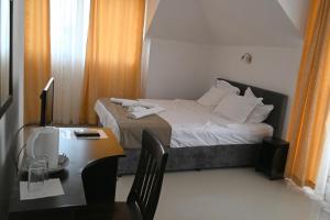 Postel nebo postele na pokoji v ubytování Hotel Paradise