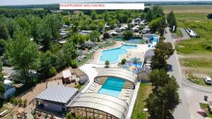 an aerial view of a resort with a pool at MHVACANCES LOUENT PLUSIEURS MOBILHOMES DANS CAMPING 4 ETOILES PROCHE CHATEAUX et ZOO BEAUVAL in Onzain