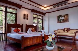 Postel nebo postele na pokoji v ubytování Kooncharaburi Resort - Koh Chang
