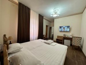 Old Bukhara Boutique客房内的一张或多张床位