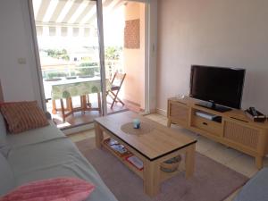 Televízia a/alebo spoločenská miestnosť v ubytovaní Le Barcares bel appartement 62m2 -2 chambres
